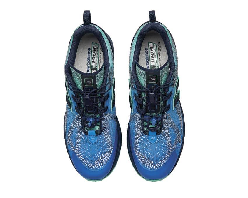 New Balance 1906F Blue Bird détail — logo N et empiècements bleu azur premium