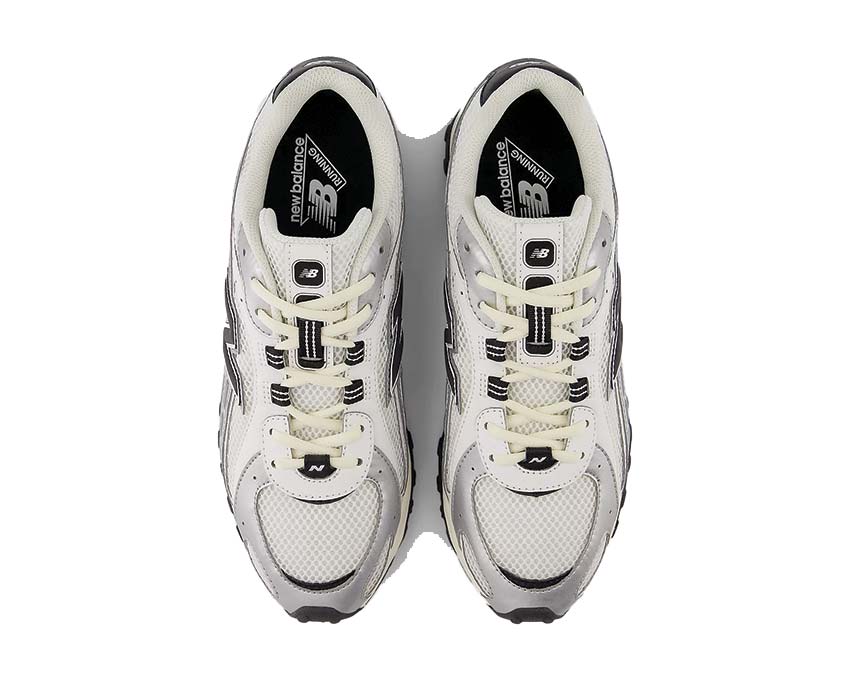 New Balance 204L Silver Metallic detail — silver N logo on chrome metallic upper