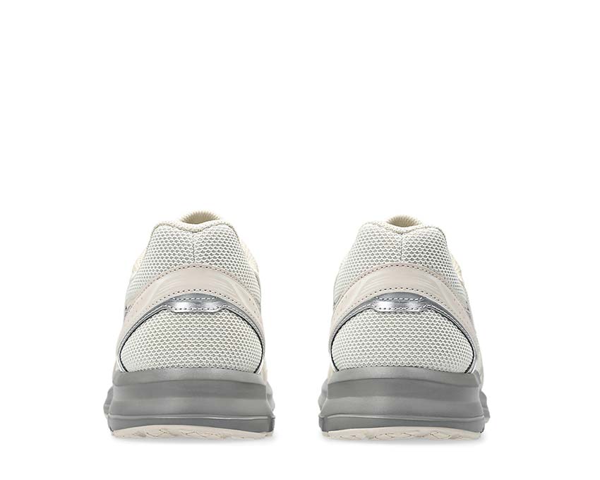 Asics Jog 100S Cream/Feather Grey détail — cuir et mesh rétro premium