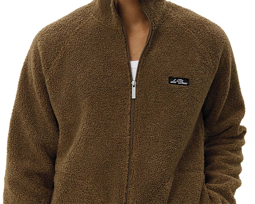 Les Deux Creed Teddy Jacket détail — texture teddy et fermeture zippée