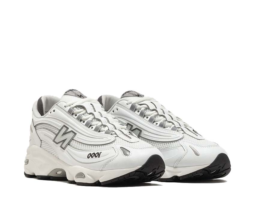 New Balance 1000D White vista laterale — silhouette trail urbano tutto bianco