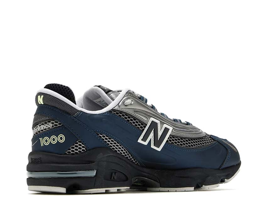 New Balance 1000 Deep Ocean vista lateral — cuero y malla azul océano profundo
