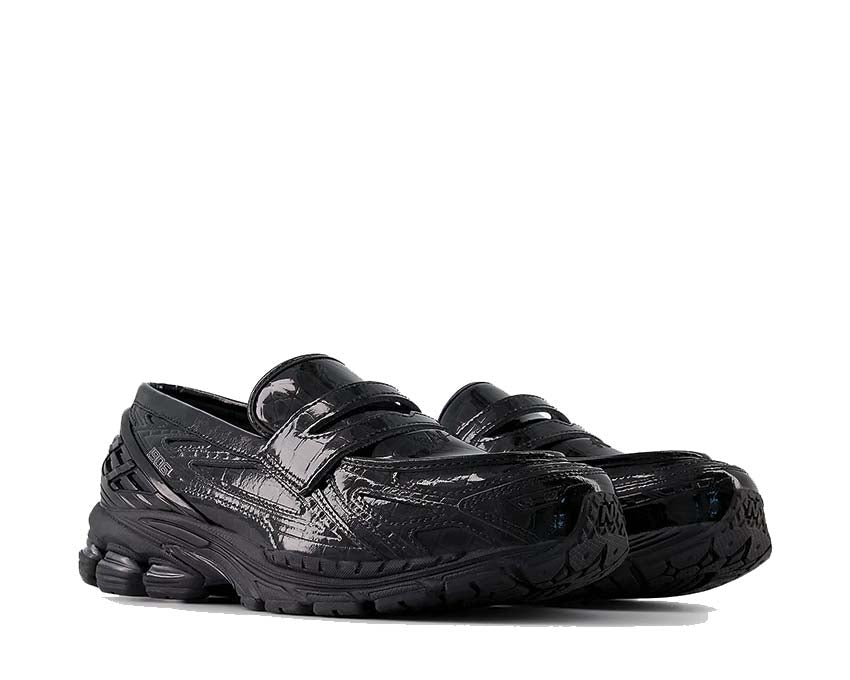 New Balance 1906L Black vista lateral — perfil en cuero