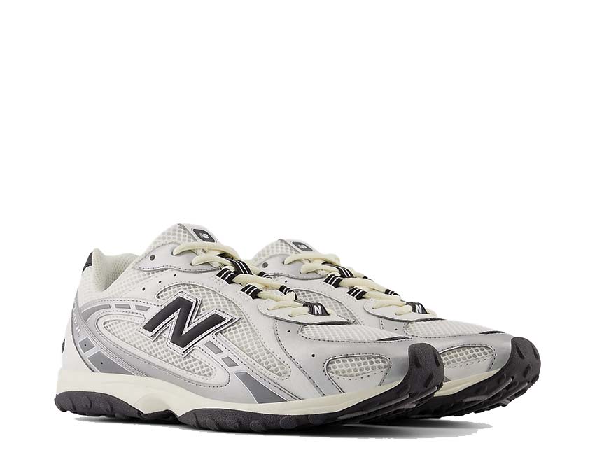 New Balance 204L Silver Metallic side view — iridescent silver profile smooth upper