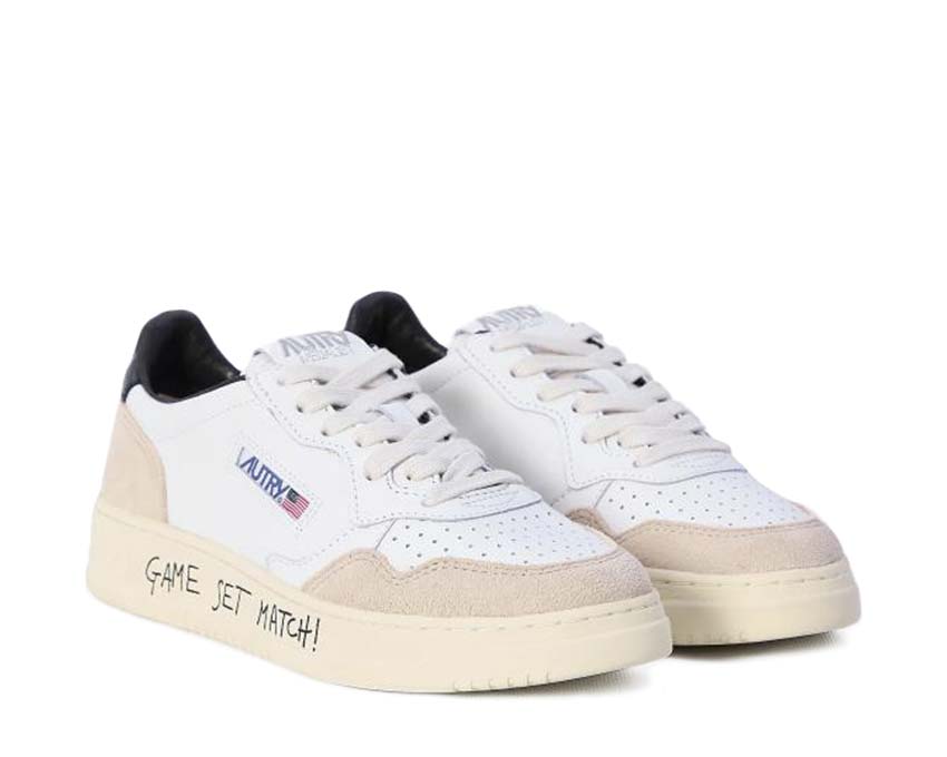 Autry Medalist Low Match White Black side view — two-tone white and black suede