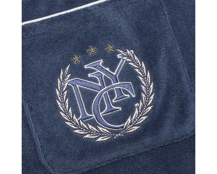 Puma X Rhuigi Shirt Inky Blue détail — broderie Puma et logo Rhuigi Villaseñor