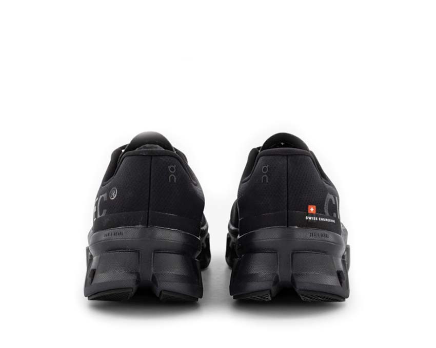 On Cloudmonster All Black side view — CloudTec cushioning