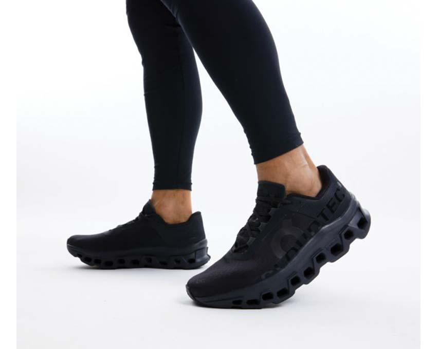 On Cloudmonster All Black detail — engineered mesh upper